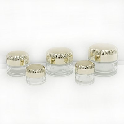 gold round cap cream jar